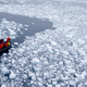 A team of researchers wade through melting Antarctic ice on January 22nd, 2015. Image: AP Photo/Natacha Pisarenko